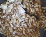 A picture of step 2 of Biryani (rice with spices and vegetables).