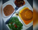 A picture of step 7 of Moi moi with palm oil sauce and lettuce.