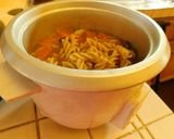 A picture of step 3 of Spicy, cheesy Tomato, mushroom noodle soup.