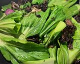 A picture of step 5 of Mushroom stir fry with Bak Choy, Chilies and Sausage.