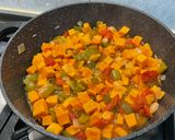 A picture of step 13 of Sweet Potato with Green Bell Pepper and Tomatoes in Fruity Sauce.