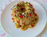 A picture of step 16 of Thandai Bundt cake with Kesar thandai Rabdi frosting.