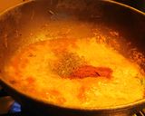 A picture of step 4 of Pasta sizzler sizzling with hot chilli powder, veggies, cheese.