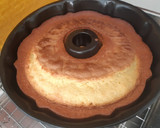 Foto del paso 6 de la receta: Bizcocho de naranja bañado en chocolate con almendras laminadas
