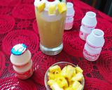 A picture of step 7 of Virgin Yakult Pina Colada topped with Whipped Cream.