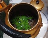 A picture of step 2 of Tulsi and Palm Jaggery Tea.