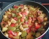 A picture of step 6 of Capsicum, Fry potato and Tomato Subji.