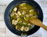 A picture of step 3 of Ajillo with Lots of Umami Taste from Shiitake Powder.