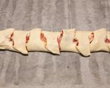 A picture of step 3 of Sun-dried tomato and prosciutto tear and share.