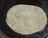 A picture of step 2 of Paneer tikka masala with cheese naan.