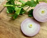 A picture of step 2 of Tomato, Parsley, and Onion Salad.