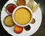 A picture of step 1 of पंचरत्न खिचडी (daliya khichdi recipe in Marathi).