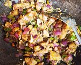 A picture of step 3 of Fried Plain Dhokla (without sugar) with veggies and Sauce.