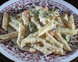 A picture of step 5 of Penne pasta in white sauce (with fresh cream and cheese).