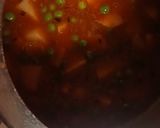 A picture of step 4 of Aloo matar in red gravy.