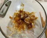 A picture of step 1 of Onigiri with bonito flakes and cheese.