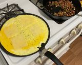 A picture of step 2 of Spam, Egg & Cheese Open Faced Sandwich.