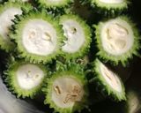 A picture of step 1 of Lunch time special Kurkure Karele / Crispy Bitter Gourd.