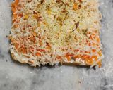 A picture of step 4 of Carrot toast with cheese spread.
