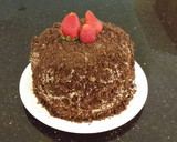 A picture of step 29 of Chocolate Layer Cake with Strawberry Cream Filling, White Chocolate Ganache Frosting coated with a Chocolate Crumble.