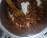A picture of step 6 of Sausage pilau.