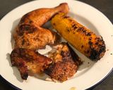 A picture of step 7 of Beer can chicken on the Braai (BBQ) with coal charred corn on the cob.