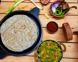 A picture of step 5 of Jawar Bhakri with Baingan Bharta.
