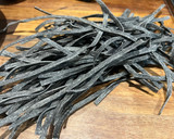 A picture of step 1 of Tagliolini al nero di seppia con granchio – Venetian squid ink tagliolini with crab.