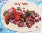A picture of step 3 of Alexandrian Hawawshi with Sausage.