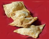 A picture of step 9 of Sweet apple samosa turn over.