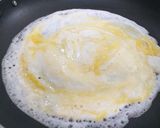 A picture of step 5 of Mutta Dosa (egg dosa).