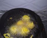 A picture of step 3 of Aloo (potato) bada with curry.