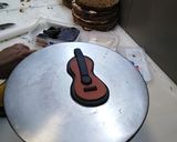 A picture of step 2 of Birthday cake music theme top on fondant guitar 🎸🎸🎸.
