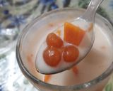 A picture of step 10 of Mango Boba Drink (with homemade mango bubbles).