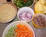 A picture of step 3 of Potato fried rice and meat fried rice with coloured eggs.