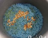 A picture of step 3 of Blue Ghee Rice with Pine nuts.