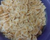 A picture of step 1 of Chicken cheese white sauce farfalle pasta.