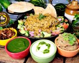 A picture of step 5 of Uttar Pradesh Urad Daal Aur Naye Chawal ki Khichdi Aloo Bharte Aur Hari Chutney (dinner or lunch).