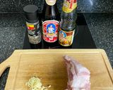 A picture of step 1 of Roasted garlic marinated pork collar with spicy Thai-style sauce.