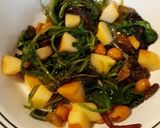 A picture of step 5 of Wilted greens with apples, raisins & nuts.