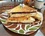 Foto langkah ke 7 dari resep Chocolate Cheese Almond Sandwich.
