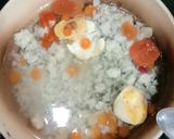 Foto langkah ke 3 dari resep MPASI 6m Bubur Telur Tomat Wortel.