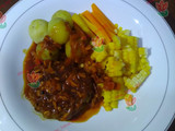 Steak with vegetables and black paper sauce
