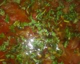 A picture of step 10 of Besni masala prahta with tomato souce.