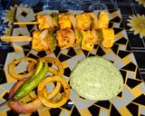A picture of step 4 of Achari paneer tikka with achari onion rings.