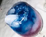 A picture of step 3 of Rose and layered blue Paradise mocktail.