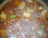 A picture of step 6 of Aloo qeema.