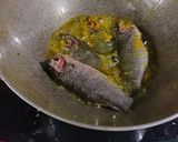 A picture of step 1 of Koi komola, climbing fish curry with orange juice.