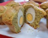 A picture of step 3 of Savory Pesto Muffins with a Surprise Center 🐣.