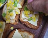 A picture of step 3 of Corn 🌽 Capsicum 🫑 Cheesy Toast.